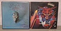 Front covers Eagles and Judas Priest albums