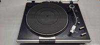 Top view of JVC JL-A40 turntable showing platter, mat, tonearm, controls