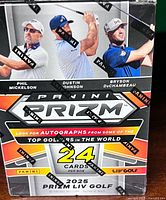 Front view of sealed 2025 Panini Prizm LIV Golf box showing golfers and 24 cards per box text