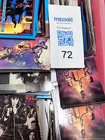 Top view showing stacks of various themed cards in plastic bin