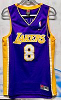 Front view of Lakers jersey showing wordmark, number, logos, jock tag