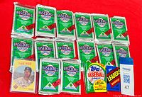 All sealed packs and loose Fred Kipp card laid out