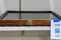 Closed display case front view with latch visible