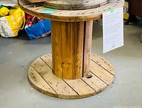 Full view of wooden cable spool