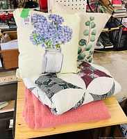 Overall view showing pillows, quilt, blanket