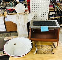 Lot overview showing stool, enamel bowl, wire basket, wooden angel