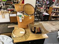 Group shot showing all items: Billabong tote, two round wicker pieces, square handled basket, seagrass bowl with brushes