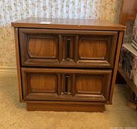 Front view of one nightstand showing two drawers and overall style