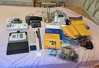 Overview of entire lot on bed showing all items