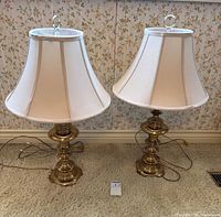 Front view of both brass lamps with shades
