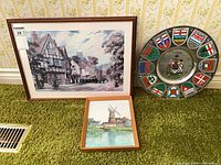 All three items together: two framed prints and metal plate