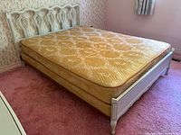 Full view of bed frame with mattress and box spring