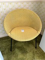 Front view of yellow resin wicker chair