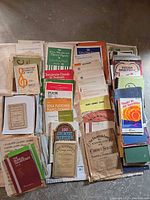 Overview of assorted sheet music spread on floor