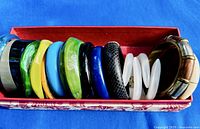 Full lot of thirteen bracelets inside red box