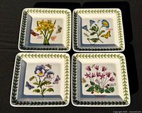 Four square Portmeirion Botanic Garden plates with varied floral motifs