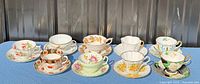 Group shot of all ten teacup and saucer sets