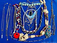 All necklaces laid out to show variety, pendants and bead styles