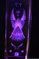 Crystal angel lit purple on base