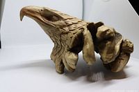 Right-side view of carved burl wood eagle head
