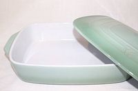 Dish open showing white interior and sage exterior