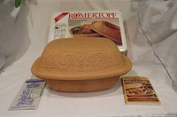 Clay baker with lid, box, booklets displayed