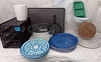 Group shot showing all items including grill, plates, drawers, bowls, trays