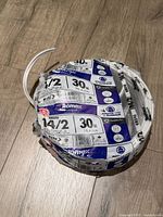 Top view of sealed Romex NMD90 14/2 wire roll showing 30 m specification