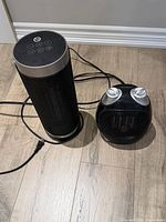 Front view of both heaters showing Dreo tower and compact tabletop model