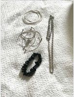 Group with bangles, hoop earrings, black bead bracelet, link chain