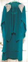Turquoise beaded dress with matching jacket hanging