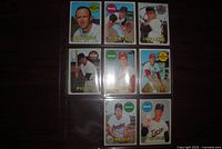 Front view of eight 1969 Topps baseball cards in plastic sheet