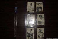Fronts of six 1970-71 deckle-edge hockey cards in plastic sheet