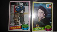 Fronts of both rookie cards in sleeves: Hardy Astrom and Jim Craig
