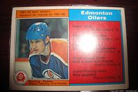 Front of 1982-83 O-Pee-Chee Wayne Gretzky #99 card showing player image and team leader stats