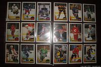 Front view of all 20 hockey cards arranged in four rows of five showing design, teams and condition