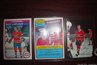 Front view of two trading cards and signed photo of Guy Lafleur