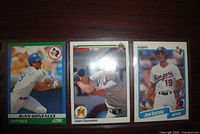 Fronts of three Juan Gonzalez rookie baseball cards from 1990 Score, Upper Deck and Fleer