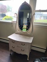 Front view showing dresser, mirror, legs and overall style
