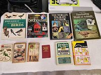All ten books laid out on table for overview