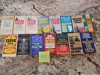All 15 books laid out on countertop