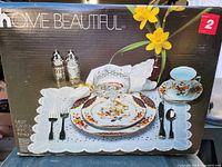 Front of box showing Home Beautiful Canton Fair china place setting