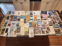 Full tabletop view of all folded maps, tour booklets and brochures