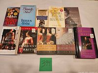 Front covers of all ten books laid out on table