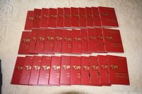 Full set of 33 red hardcover volumes laid out