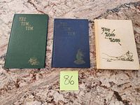 Front covers of three yearbooks: green 1946, blue 1947, tan 1948