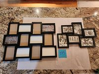 Front view of both black collage picture frames displaying design and photo openings