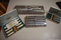 Group shot of all four boxed Carvel Hall sets