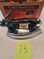 Front view of Toastmaster iron with original box