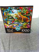 Front of Buffalo Vivid 1000-piece puzzle box showing animal artwork